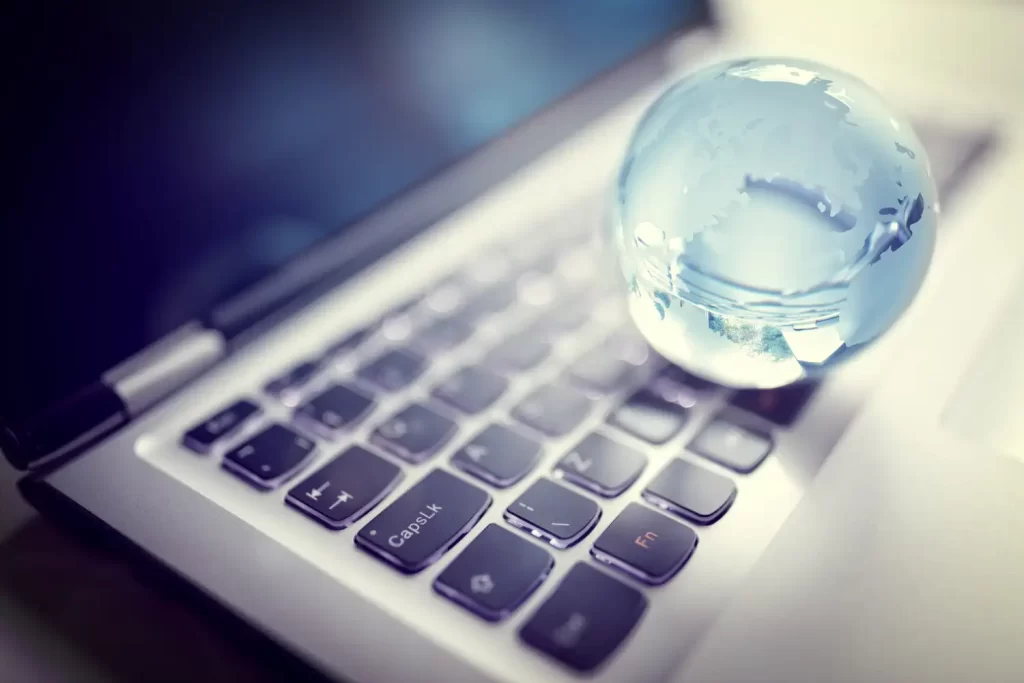 A crystal globe on a laptop keyboard